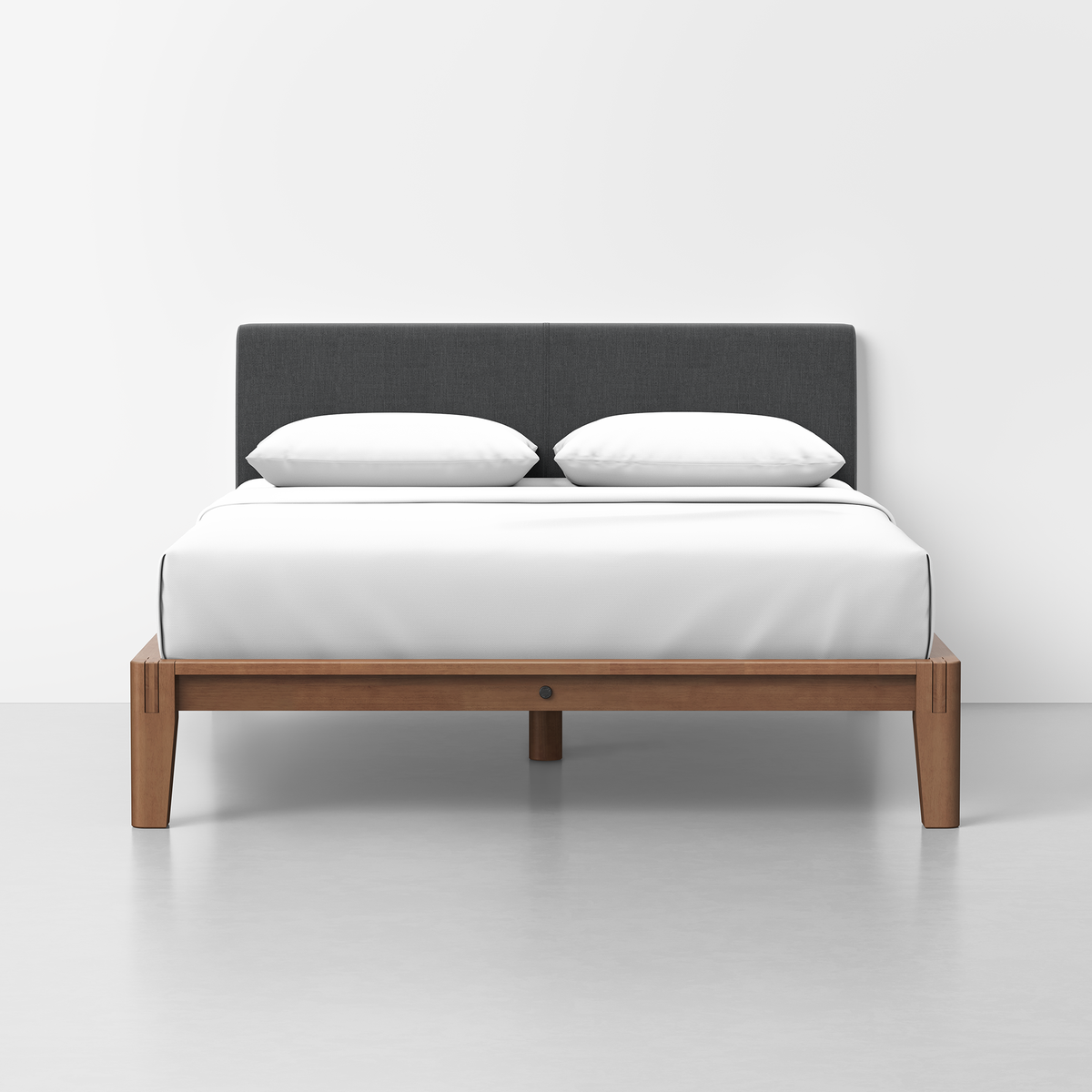 The Classic Bed - Combined Listing features a modern wooden frame, dark gray upholstered headboard, white bedding, and two white pillows, set against a plain white wall and floor.